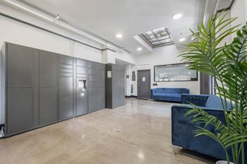 Common area with couch at Grand Central Market Apartments, Los Angeles 